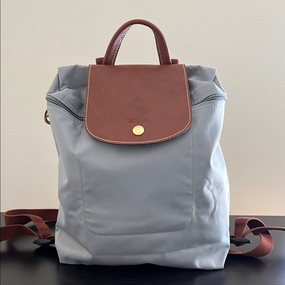 Longchamp backpack leather flap zip closure